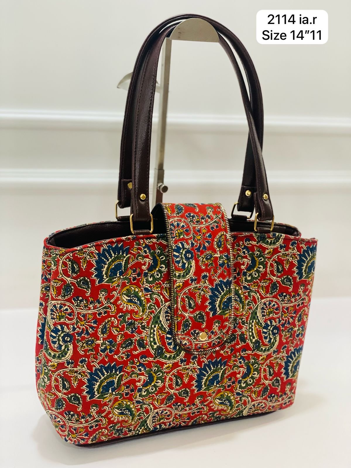 Formal hard box sling with trendy handblock prints